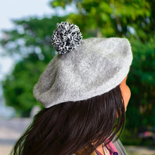 Warm winter beret cap in stylish design, suitable for men and women.